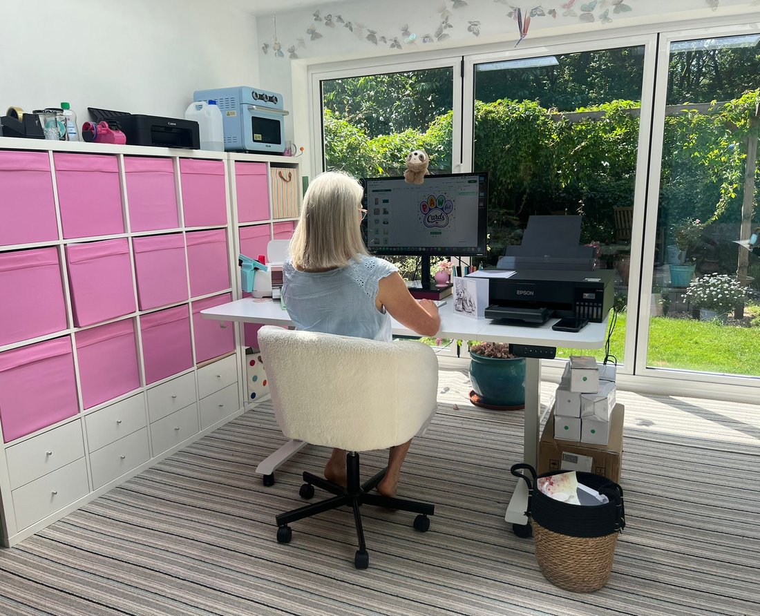 Juliette designing pet cards in her studio